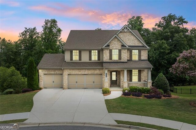 2330 Cheatham Creek Ct, Cumming, GA 30040 - craftsman house featuring concrete driveway, covered porch, and stone siding