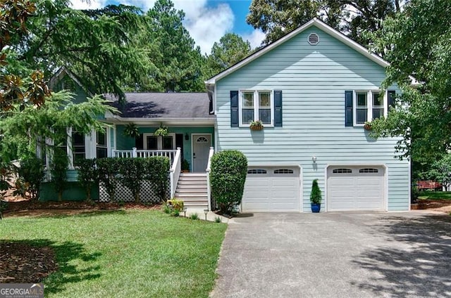 368 Lambeth Dr, Hiram, GA 30141 - split level home featuring a porch, a garage, driveway, a front lawn, and stairway