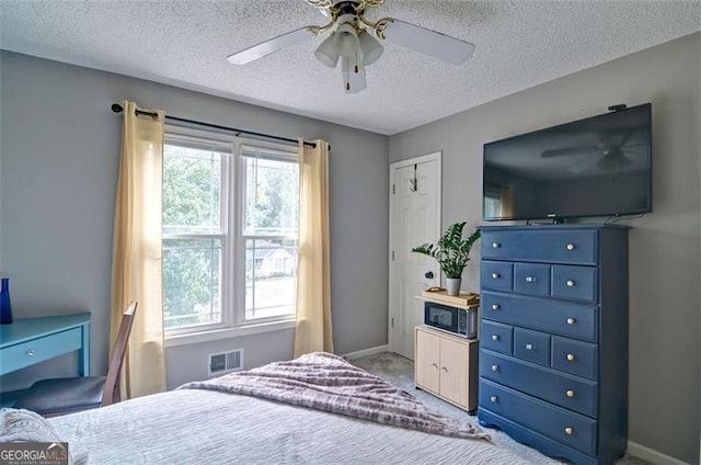 368 Lambeth Dr, Hiram, GA 30141 - carpeted bedroom with a textured ceiling, baseboards, and ceiling fan