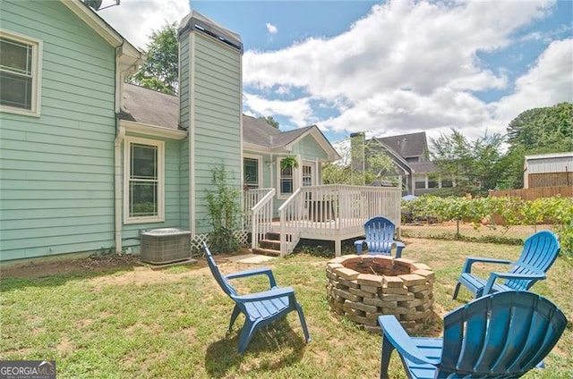 368 Lambeth Dr, Hiram, GA 30141 - view of green lawn with an outdoor fire pit, cooling unit, and a deck