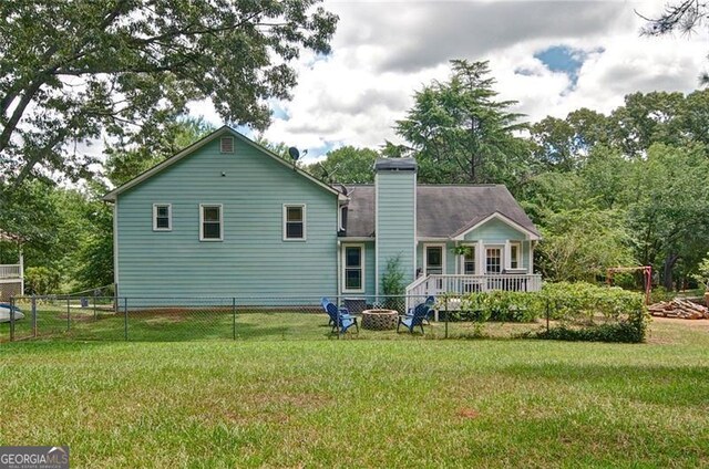 368 Lambeth Dr, Hiram, GA 30141 - rear view of property featuring a chimney and a fire pit