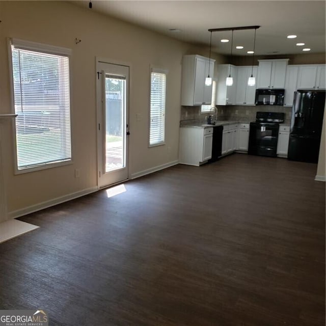 1030 Glenwyck Dr, Braselton, GA 30517 - kitchen with black appliances, dark wood finished floors, baseboards, light countertops, and recessed lighting