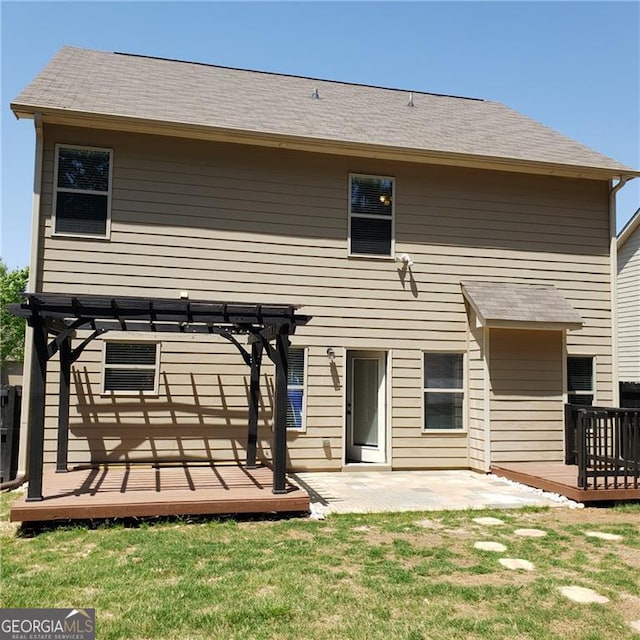 1030 Glenwyck Dr, Braselton, GA 30517 - rear view of house featuring a deck, a pergola, a lawn, and a patio area