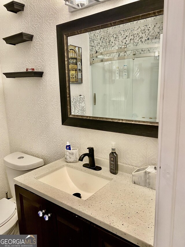 5 Red Fox Dr SW, Rome, GA 30165 - bathroom featuring vanity, toilet, and a shower stall