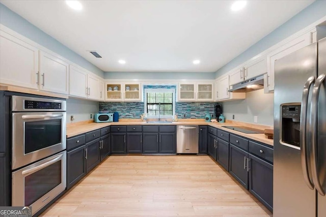 103 Ashley Marsh Dr, Brunswick, GA 31523 - kitchen featuring appliances with stainless steel finishes, under cabinet range hood, white cabinets, light countertops, and recessed lighting