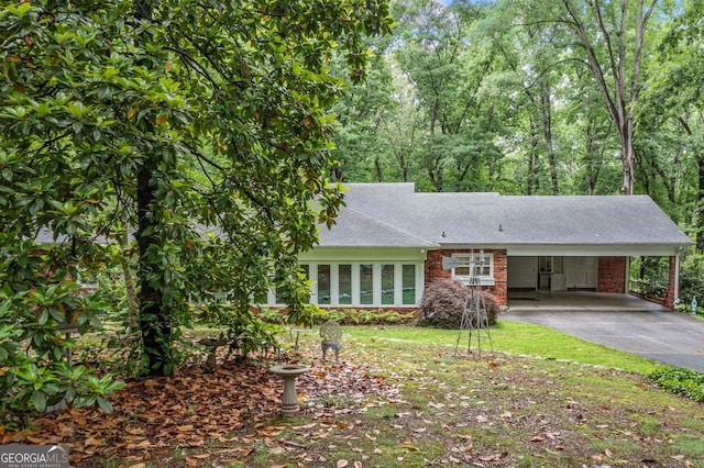 286 Hilton Way, Canton, GA 30114 - view of front facade with asphalt driveway, a carport, roof with shingles, and brick siding