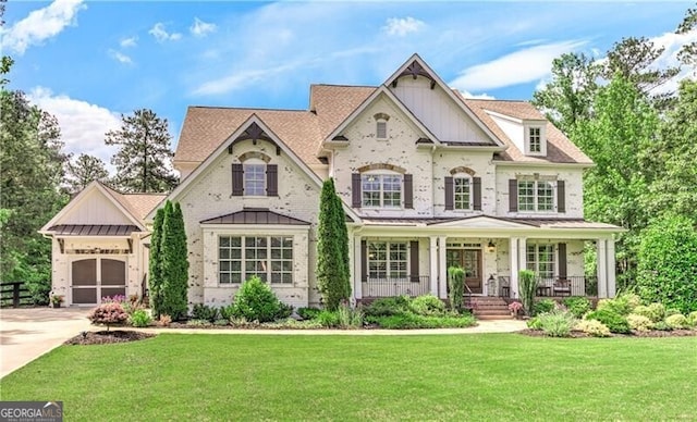 126 Townsend Pass, Alpharetta, GA 30004 - view of front facade with a porch, concrete driveway, a front lawn, and brick siding