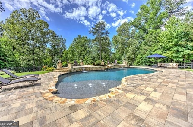 126 Townsend Pass, Alpharetta, GA 30004 - outdoor pool with a patio, view of wooded area, and an outdoor hot tub