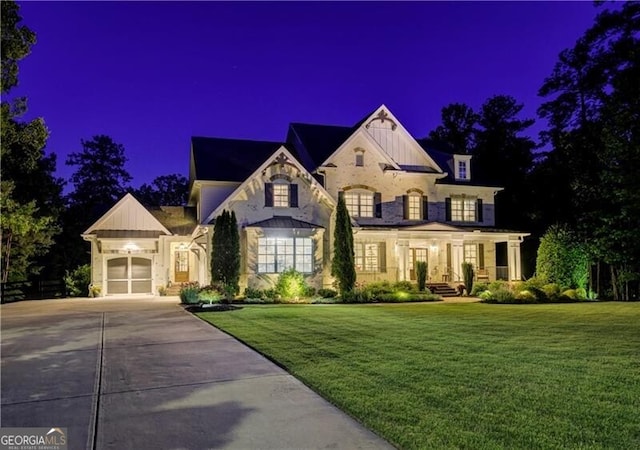 126 Townsend Pass, Alpharetta, GA 30004 - french country inspired facade featuring board and batten siding, concrete driveway, a lawn, and a garage