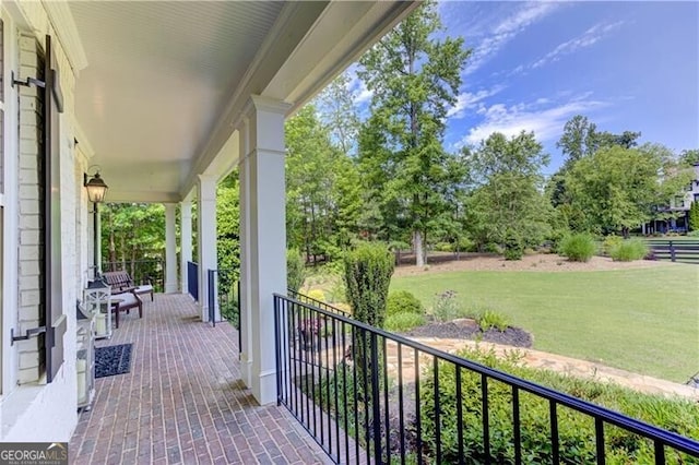 126 Townsend Pass, Alpharetta, GA 30004 - porch featuring a lawn and view of wooded area