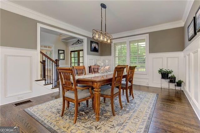 126 Townsend Pass, Alpharetta, GA 30004 - dining room featuring a decorative wall, crown molding, healthy amount of natural light, a chandelier, and stairway