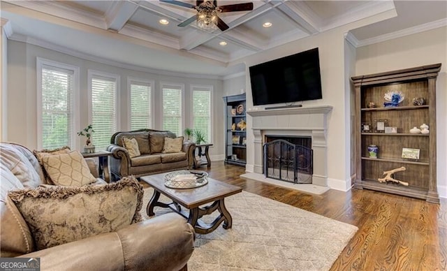 126 Townsend Pass, Alpharetta, GA 30004 - living area with wood finished floors, a fireplace with raised hearth, ceiling fan, beam ceiling, and crown molding