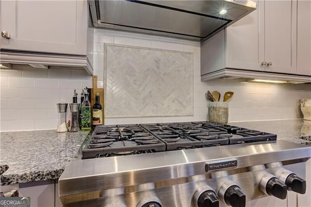 126 Townsend Pass, Alpharetta, GA 30004 - kitchen featuring ventilation hood, decorative backsplash, and light stone countertops