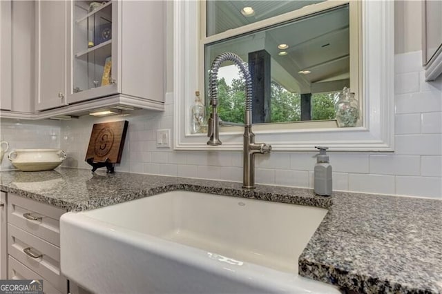 126 Townsend Pass, Alpharetta, GA 30004 - kitchen view of backsplash, glass insert cabinets, stone counters, and white cabinets