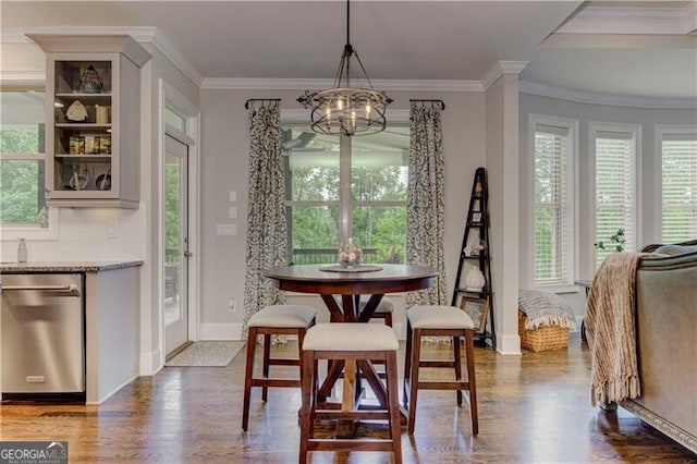 126 Townsend Pass, Alpharetta, GA 30004 - dining area featuring dark wood finished floors, healthy amount of natural light, a chandelier, and crown molding