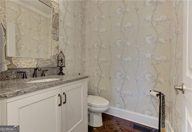 126 Townsend Pass, Alpharetta, GA 30004 - half bathroom with wood finished floors, vanity, and wallpapered walls