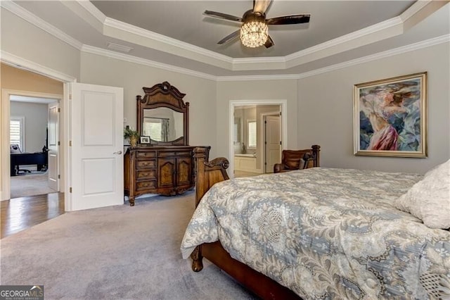 126 Townsend Pass, Alpharetta, GA 30004 - bedroom featuring a tray ceiling, crown molding, carpet, ensuite bath, and a ceiling fan