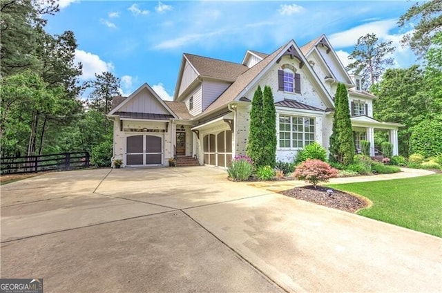 126 Townsend Pass, Alpharetta, GA 30004 - view of front of house featuring driveway, a garage, brick siding, and board and batten siding