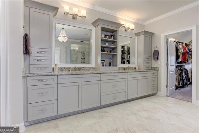 126 Townsend Pass, Alpharetta, GA 30004 - bathroom featuring ornamental molding, double vanity, a walk in closet, and tiled shower