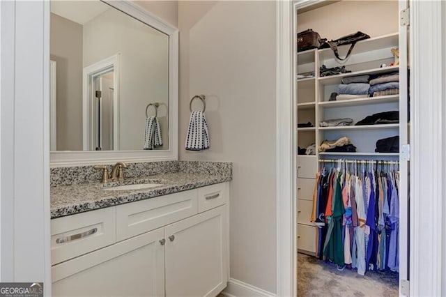 126 Townsend Pass, Alpharetta, GA 30004 - bathroom featuring vanity and a spacious closet