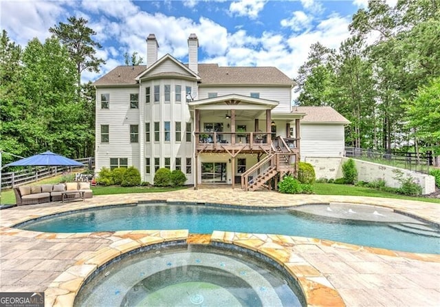 126 Townsend Pass, Alpharetta, GA 30004 - view of swimming pool with stairs, a ceiling fan, an outdoor hangout area, a pool with connected hot tub, and a patio area
