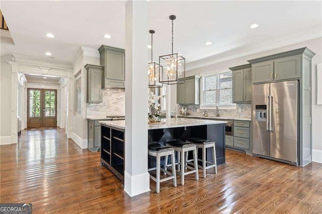 3834 Chamblee Dunwoody Rd, Atlanta, GA 30341 - kitchen featuring high quality fridge, gray cabinetry, dark wood-type flooring, decorative backsplash, and crown molding