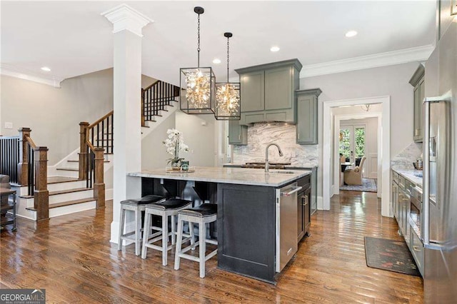 3834 Chamblee Dunwoody Rd, Atlanta, GA 30341 - kitchen featuring light stone counters, decorative backsplash, dark wood-style flooring, crown molding, and stainless steel appliances
