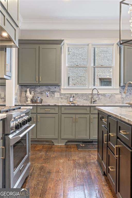 3834 Chamblee Dunwoody Rd, Atlanta, GA 30341 - kitchen featuring high end stove, ornamental molding, exhaust hood, light stone counters, and tasteful backsplash