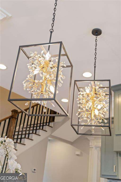 3834 Chamblee Dunwoody Rd, Atlanta, GA 30341 - stairs featuring a chandelier