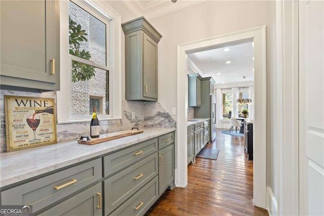 3834 Chamblee Dunwoody Rd, Atlanta, GA 30341 - kitchen with ornamental molding, tasteful backsplash, gray cabinetry, dark wood-type flooring, and light stone countertops