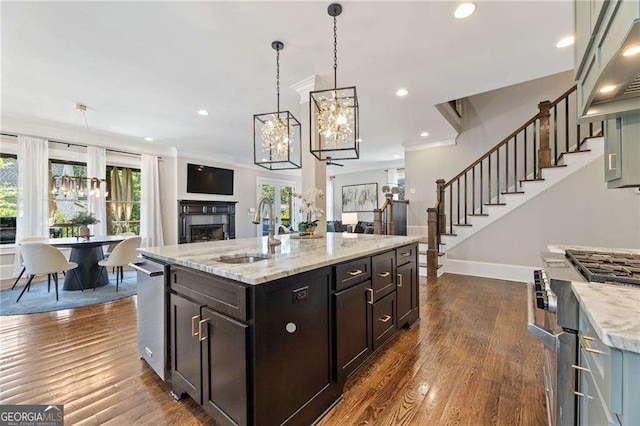 3834 Chamblee Dunwoody Rd, Atlanta, GA 30341 - kitchen with stainless steel appliances, a fireplace, open floor plan, a chandelier, and recessed lighting