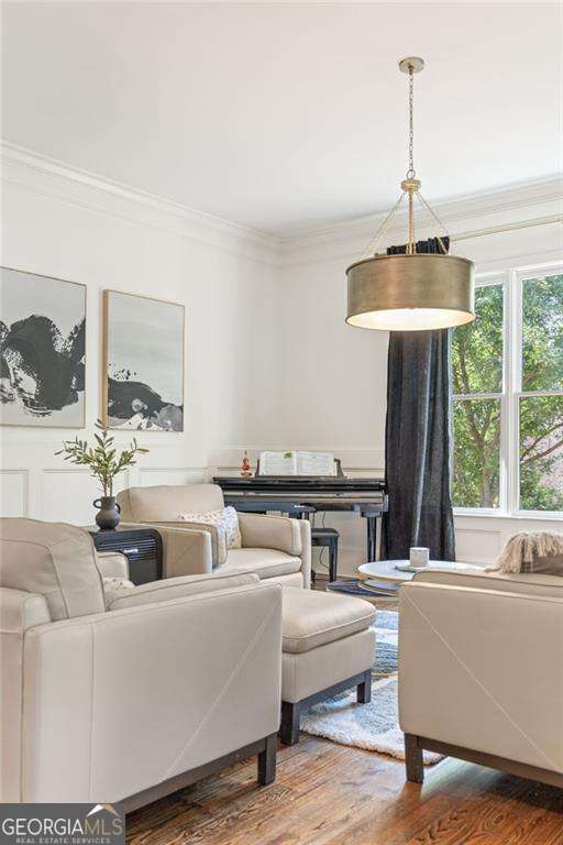 3834 Chamblee Dunwoody Rd, Atlanta, GA 30341 - living area featuring ornamental molding and wood finished floors