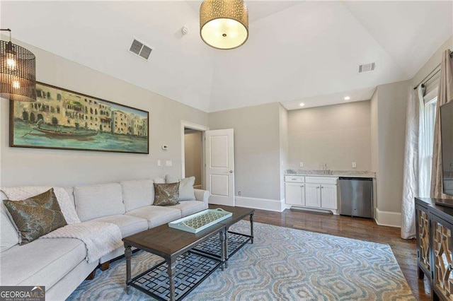 3834 Chamblee Dunwoody Rd, Atlanta, GA 30341 - living room featuring dark wood-style floors, high vaulted ceiling, bar area, and recessed lighting
