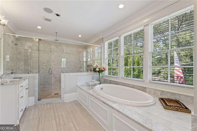 3834 Chamblee Dunwoody Rd, Atlanta, GA 30341 - bathroom with ornamental molding, a bath, a stall shower, vanity, and recessed lighting