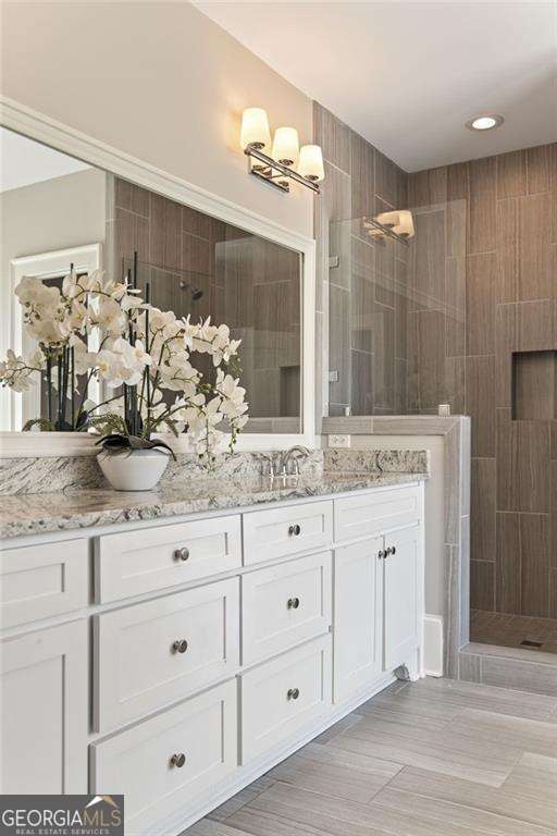 3834 Chamblee Dunwoody Rd, Atlanta, GA 30341 - bathroom featuring double vanity and a walk in shower