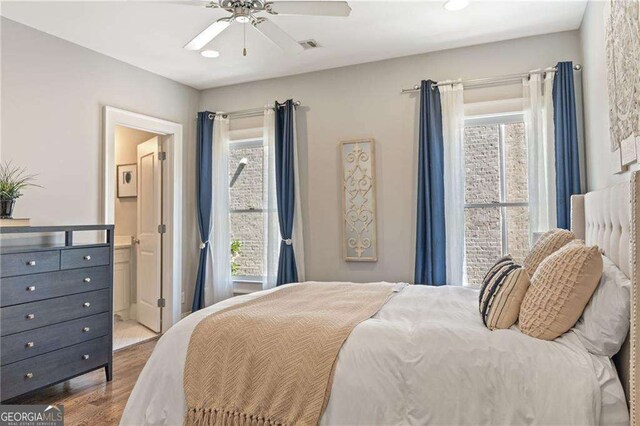 3834 Chamblee Dunwoody Rd, Atlanta, GA 30341 - bedroom with wood finished floors, ensuite bathroom, and ceiling fan