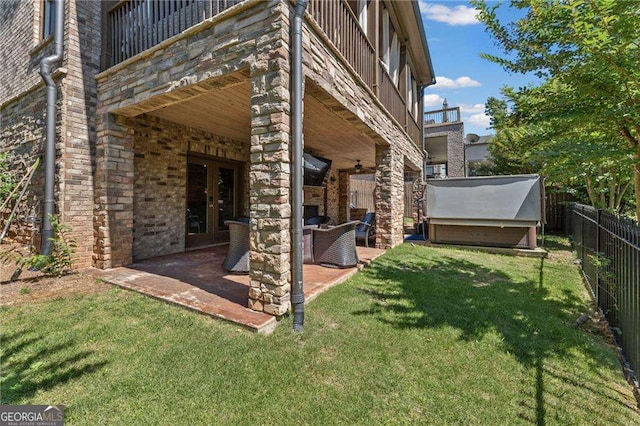3834 Chamblee Dunwoody Rd, Atlanta, GA 30341 - rear view of house with french doors, a patio, and stone siding