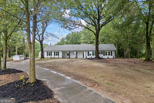1180 Treadwell Bridge Rd, Statham, GA 30666 - ranch-style house featuring a shed and driveway