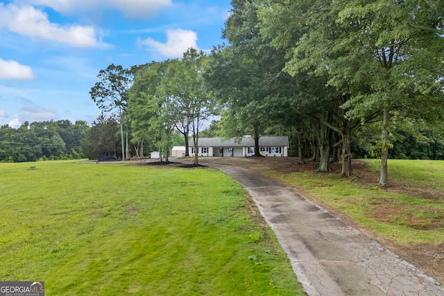 1180 Treadwell Bridge Rd, Statham, GA 30666 - surrounding community featuring a yard and asphalt driveway