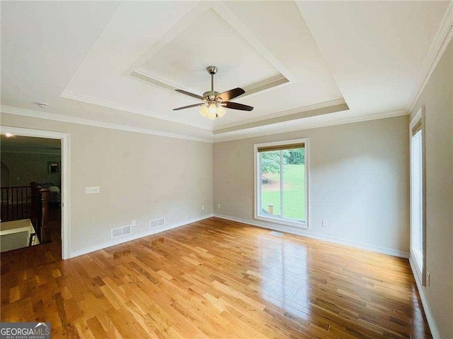345 Etheridge Rd, Auburn, GA 30011 - unfurnished room featuring a raised ceiling, wood finished floors, ceiling fan, and ornamental molding