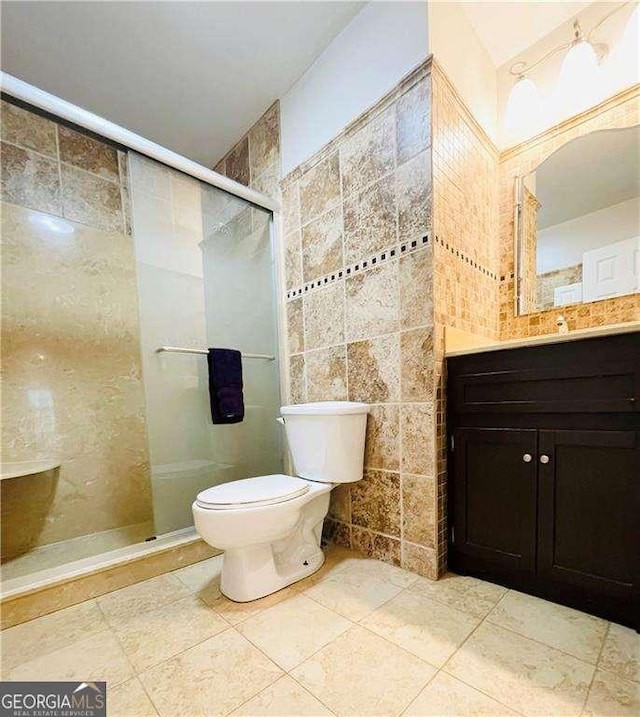 345 Etheridge Rd, Auburn, GA 30011 - full bathroom with tile walls, a stall shower, vanity, and tile patterned flooring
