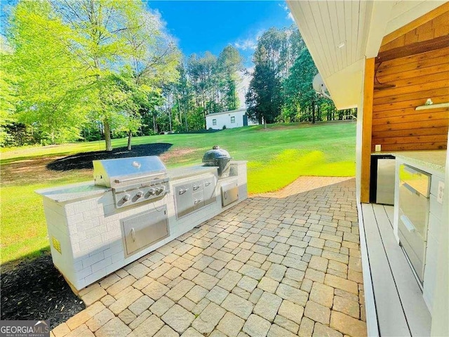 345 Etheridge Rd, Auburn, GA 30011 - view of patio / terrace with area for grilling and view of wooded area