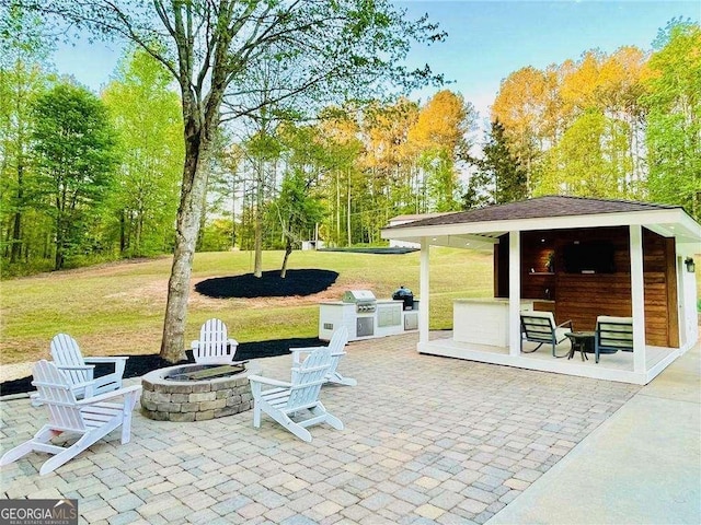 345 Etheridge Rd, Auburn, GA 30011 - view of patio / terrace featuring grilling area, an outdoor fire pit, and view of scattered trees