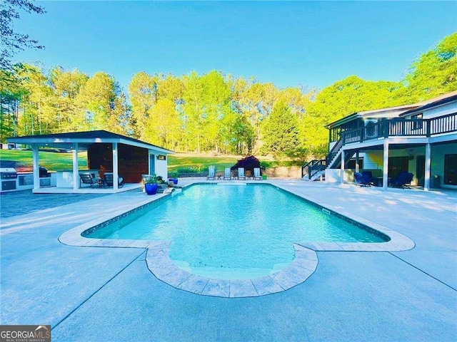 345 Etheridge Rd, Auburn, GA 30011 - swimming pool featuring stairs, a patio area, a wooden deck, and grilling area