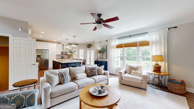 1346 Wind Chime Ct, Lawrenceville, GA 30045 - living area featuring light wood-style floors, recessed lighting, ceiling fan, and baseboards