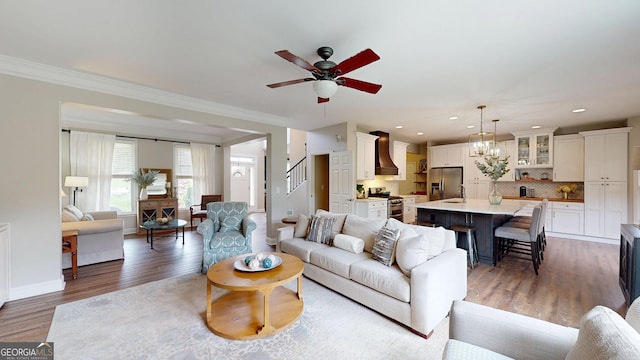 1346 Wind Chime Ct, Lawrenceville, GA 30045 - living room with a ceiling fan, crown molding, wood finished floors, recessed lighting, and baseboards