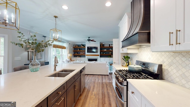 1346 Wind Chime Ct, Lawrenceville, GA 30045 - kitchen with appliances with stainless steel finishes, a sink, custom range hood, light countertops, and recessed lighting