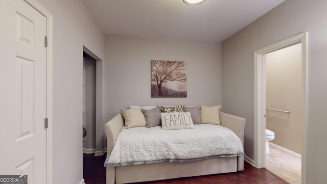 1346 Wind Chime Ct, Lawrenceville, GA 30045 - bedroom featuring baseboards, dark wood-style floors, and ensuite bathroom