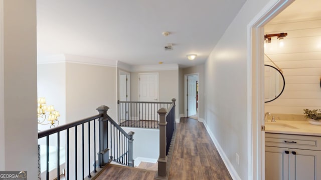 1346 Wind Chime Ct, Lawrenceville, GA 30045 - hall featuring an upstairs landing, a sink, dark wood-style flooring, and baseboards