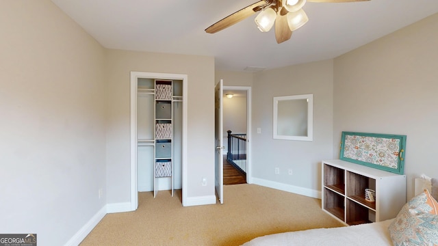 1346 Wind Chime Ct, Lawrenceville, GA 30045 - bedroom featuring carpet, baseboards, a closet, and a ceiling fan